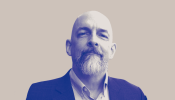 Neal Stephenson posing edited to blue and white with tan background